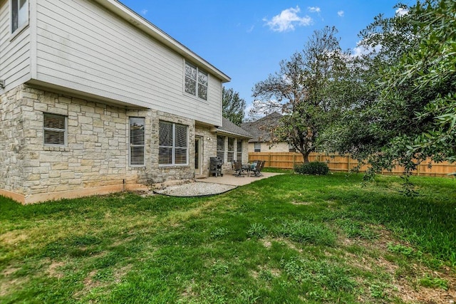 2012 Wood Glen Dr, Round Rock, TX 78681 - back of property featuring stone siding and a patio area