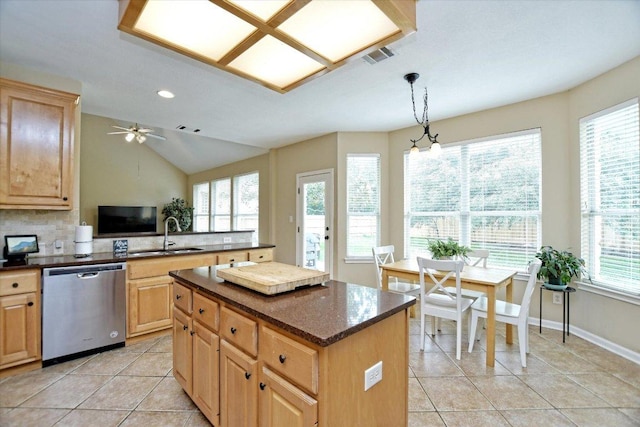 2012 Wood Glen Dr, Round Rock, TX 78681 - kitchen with dishwasher, a sink, light brown cabinets, light tile patterned floors, and lofted ceiling