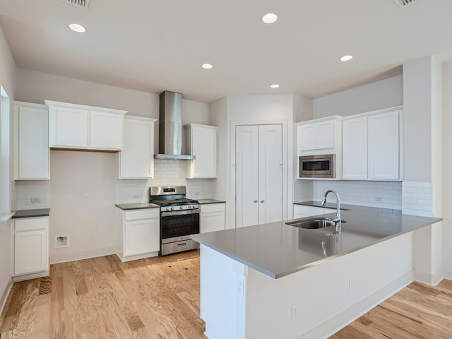 1531 N Red Bud Ln Unit 37, Round Rock, TX 78665 - kitchen featuring stainless steel appliances, wall chimney exhaust hood, decorative backsplash, and recessed lighting
