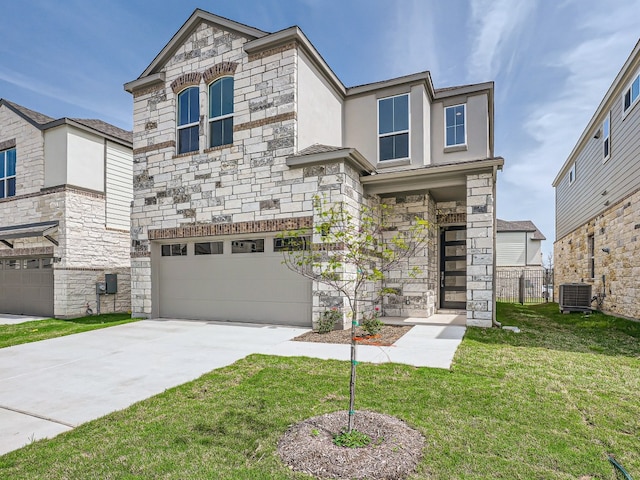 1531 N Red Bud Ln Unit 37, Round Rock, TX 78665 - view of front of home featuring stone siding, a front yard, an attached garage, and driveway