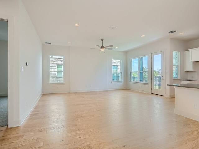 1531 N Red Bud Ln Unit 37, Round Rock, TX 78665 - unfurnished living room featuring recessed lighting, light wood-style flooring, and ceiling fan