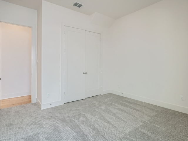 1531 N Red Bud Ln Unit 37, Round Rock, TX 78665 - unfurnished bedroom with light colored carpet and a closet