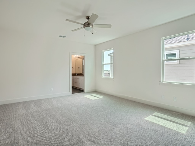 1531 N Red Bud Ln Unit 37, Round Rock, TX 78665 - carpeted empty room featuring healthy amount of natural light and ceiling fan