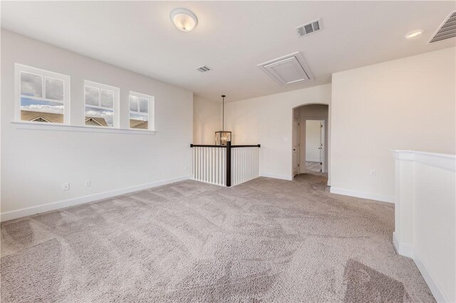 748 Hazy Hills Loop, Dripping Springs, TX 78620 - unfurnished room featuring carpet floors, arched walkways, and baseboards