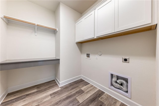 748 Hazy Hills Loop, Dripping Springs, TX 78620 - washroom featuring cabinet space, wood finished floors, electric dryer hookup, baseboards, and washer hookup