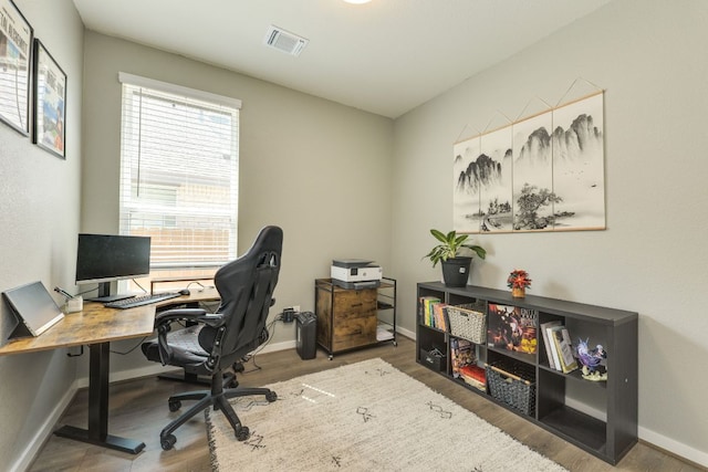 111 Blackwell Ln, Kyle, TX 78640 - office area with wood finished floors and baseboards