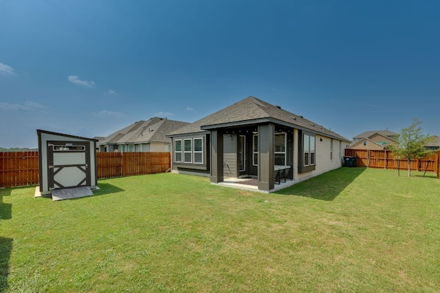 111 Blackwell Ln, Kyle, TX 78640 - rear view of house featuring a shingled roof and a patio area