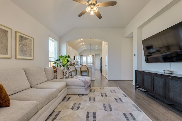 111 Blackwell Ln, Kyle, TX 78640 - living area with wood finished floors, ceiling fan, lofted ceiling, and baseboards