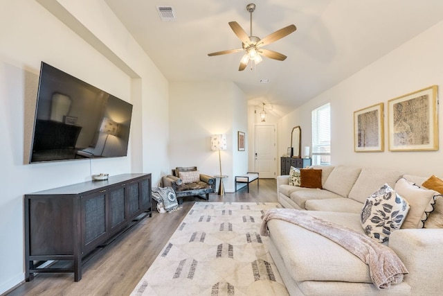 111 Blackwell Ln, Kyle, TX 78640 - living room featuring lofted ceiling, light wood-style floors, and ceiling fan