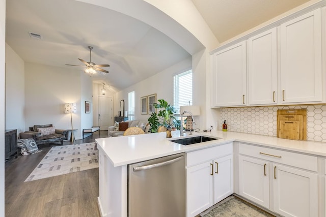 111 Blackwell Ln, Kyle, TX 78640 - kitchen featuring dishwasher, a sink, open floor plan, vaulted ceiling, and decorative backsplash