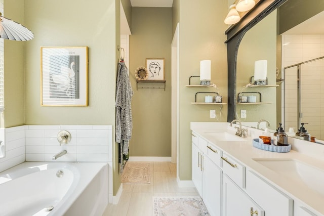111 Blackwell Ln, Kyle, TX 78640 - full bathroom with a bath, double vanity, a tile shower, baseboards, and tile patterned floors