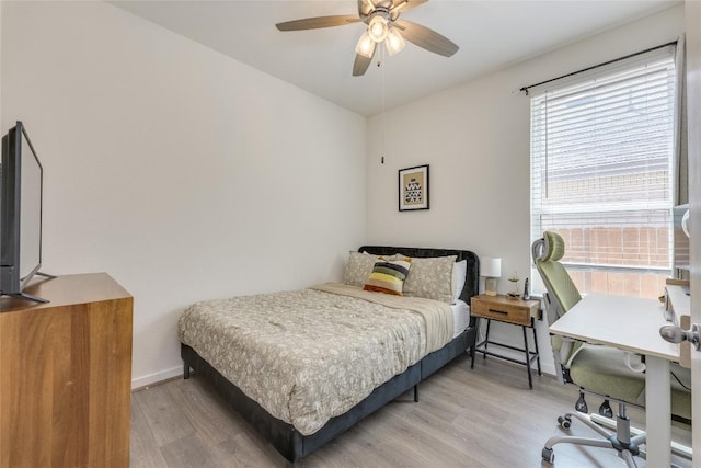 111 Blackwell Ln, Kyle, TX 78640 - bedroom with light wood-type flooring, baseboards, and ceiling fan