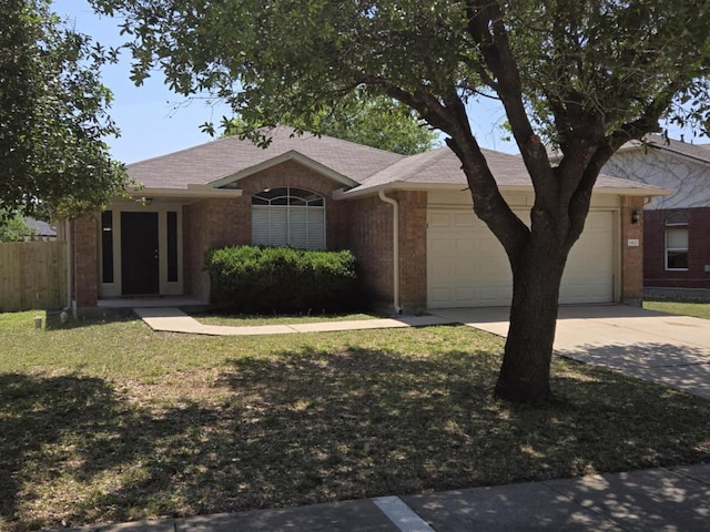 13820 Ceylon Tea Cir, Pflugerville, TX 78660 - single story home featuring a garage, driveway, brick siding, and roof with shingles