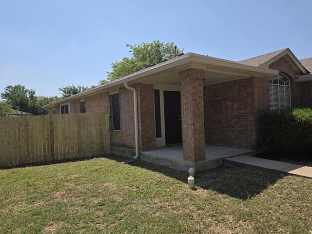13820 Ceylon Tea Cir, Pflugerville, TX 78660 - view of property exterior with brick siding and a patio area