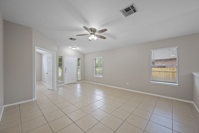 13820 Ceylon Tea Cir, Pflugerville, TX 78660 - spare room featuring light tile patterned floors, a ceiling fan, baseboards, and vaulted ceiling