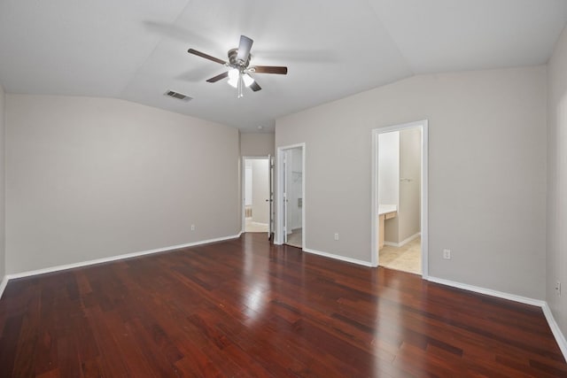 13820 Ceylon Tea Cir, Pflugerville, TX 78660 - unfurnished bedroom with vaulted ceiling, wood finished floors, connected bathroom, and baseboards