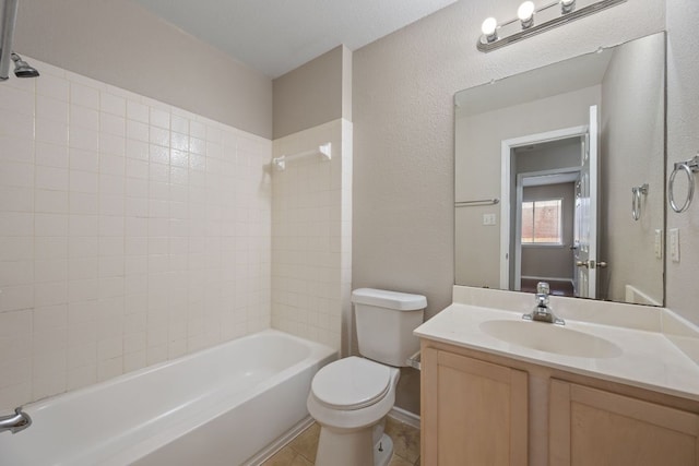 13820 Ceylon Tea Cir, Pflugerville, TX 78660 - full bathroom with toilet, vanity, tub / shower combination, a textured wall, and tile patterned flooring