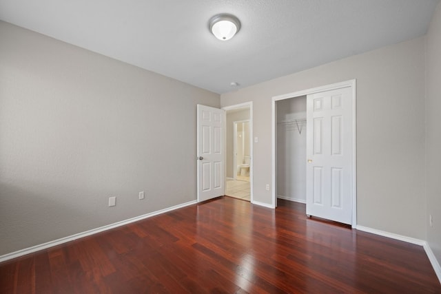 13820 Ceylon Tea Cir, Pflugerville, TX 78660 - unfurnished bedroom with wood finished floors, baseboards, and a closet