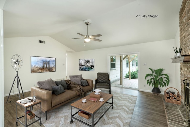 9001 Lodge Ct, Austin, TX 78758 - living area with lofted ceiling, a ceiling fan, wood finished floors, and a brick fireplace