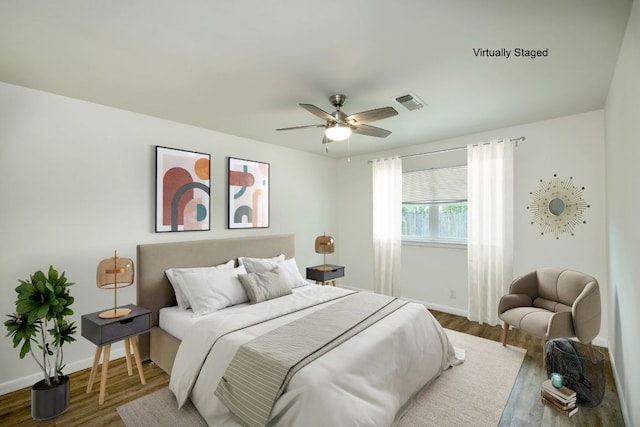 9001 Lodge Ct, Austin, TX 78758 - bedroom featuring wood finished floors and a ceiling fan