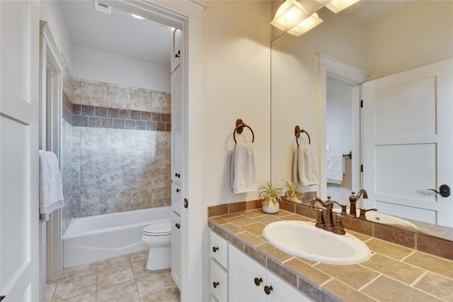 7116 Greenshores Dr, Austin, TX 78730 - bathroom with vanity, toilet, shower / bathtub combination, and tile patterned flooring