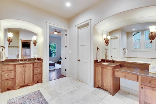 7116 Greenshores Dr, Austin, TX 78730 - ensuite bathroom with vanity, tile patterned floors, ceiling fan, and recessed lighting