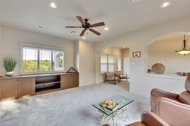 7116 Greenshores Dr, Austin, TX 78730 - living room featuring arched walkways, recessed lighting, ceiling fan, carpet floors, and baseboards