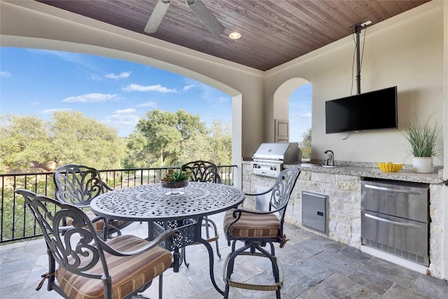 7116 Greenshores Dr, Austin, TX 78730 - view of patio featuring ceiling fan, outdoor dining area, and a sink