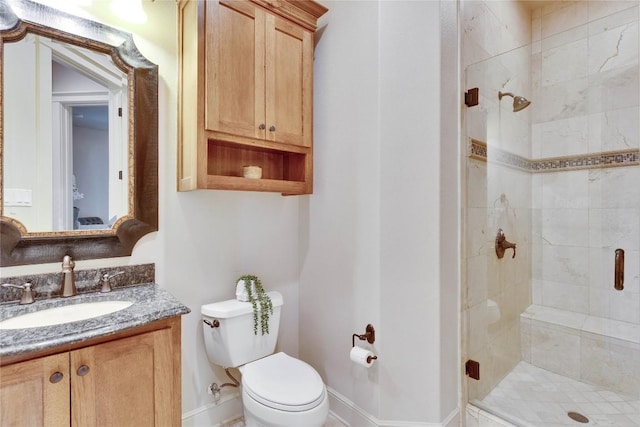 7116 Greenshores Dr, Austin, TX 78730 - bathroom featuring toilet, a shower stall, vanity, and baseboards
