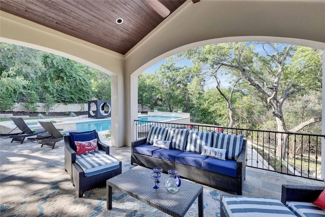 7116 Greenshores Dr, Austin, TX 78730 - view of patio / terrace with an outdoor living space, an outdoor pool, and view of scattered trees