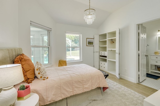 101 Peterson Ct, Austin, TX 78734 - bedroom featuring lofted ceiling, wood finished floors, and a chandelier