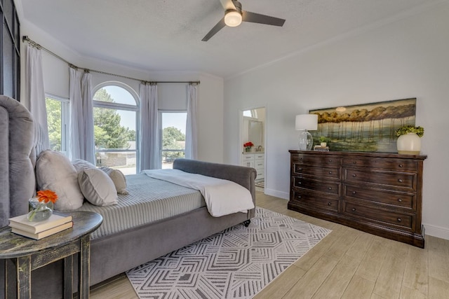 101 Peterson Ct, Austin, TX 78734 - bedroom with wood finished floors, crown molding, ceiling fan, and connected bathroom