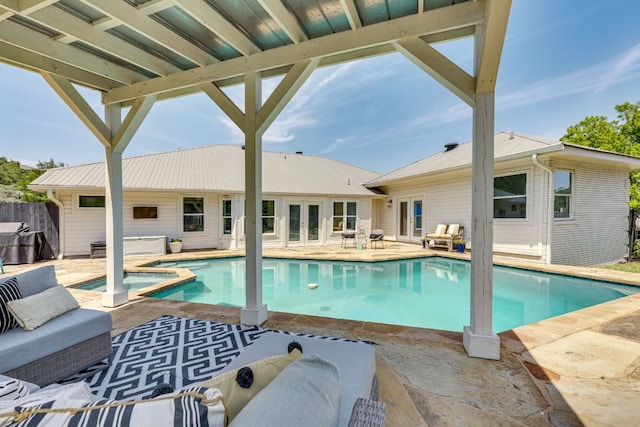 101 Peterson Ct, Austin, TX 78734 - view of swimming pool featuring a patio, french doors, a pool with connected hot tub, and a grill