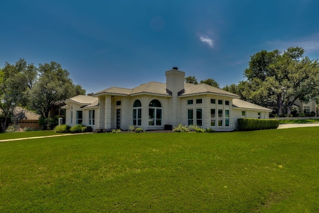 101 Peterson Ct, Austin, TX 78734 - rear view of property with a yard, a chimney, and a metal roof