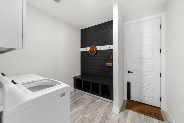 204 Love Creek Ct, Spicewood, TX 78669 - washroom with separate washer and dryer, light wood finished floors, and baseboards