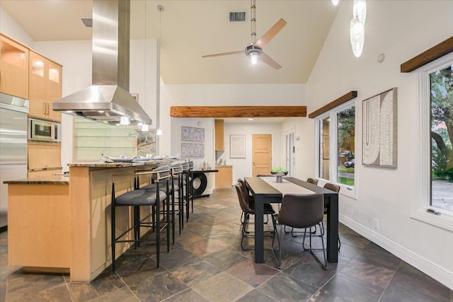 4715 Highland Ter, Austin, TX 78731 - dining space with high vaulted ceiling, stone tile floors, and ceiling fan