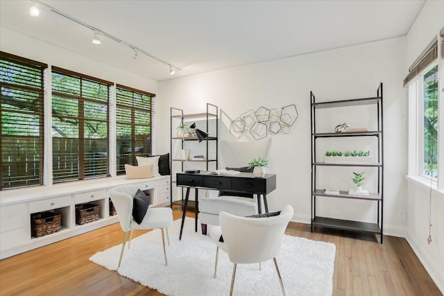 4715 Highland Ter, Austin, TX 78731 - office space with rail lighting, plenty of natural light, and wood finished floors