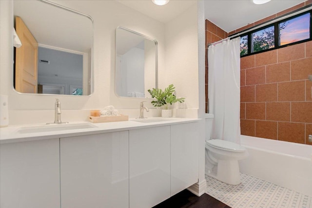 4715 Highland Ter, Austin, TX 78731 - bathroom featuring double vanity and shower / tub combo