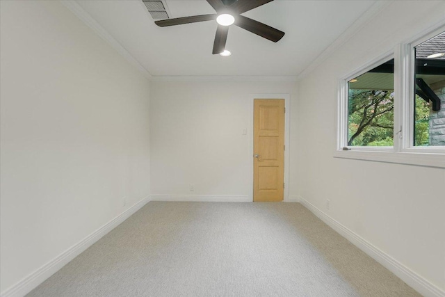 4715 Highland Ter, Austin, TX 78731 - spare room featuring crown molding, ceiling fan, and light colored carpet