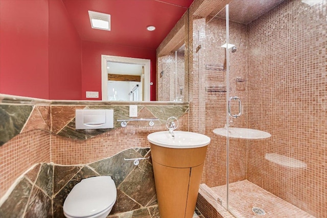 4715 Highland Ter, Austin, TX 78731 - bathroom with tile walls, vanity, a stall shower, and a wainscoted wall