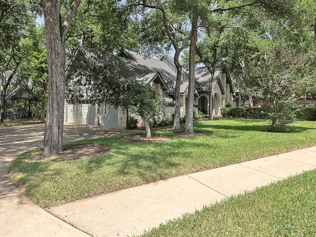 1400 Pearl Cv, Round Rock, TX 78681 - view of front of house featuring a front yard and a garage