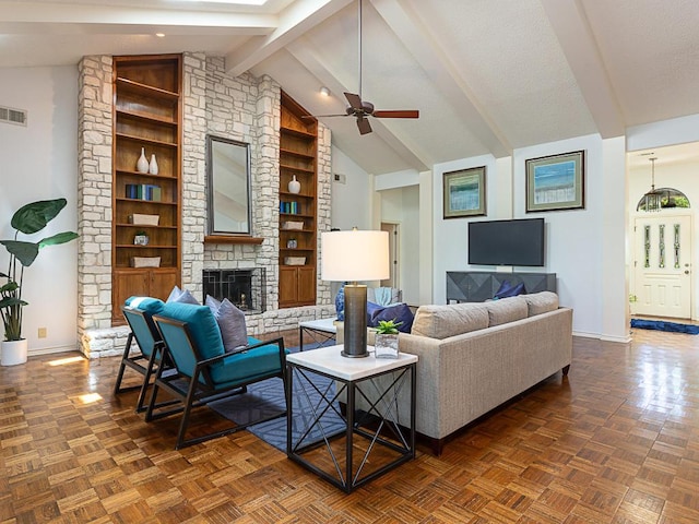 1400 Pearl Cv, Round Rock, TX 78681 - living area with a ceiling fan, a stone fireplace, and built in features