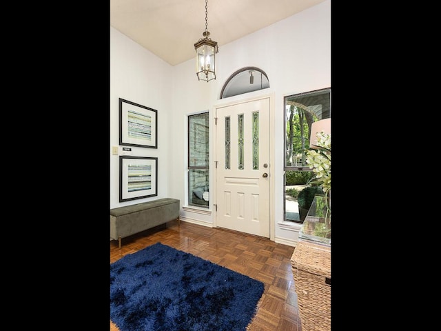 1400 Pearl Cv, Round Rock, TX 78681 - foyer entrance featuring a chandelier and vaulted ceiling