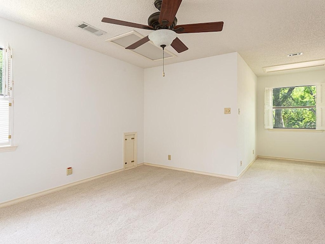 1400 Pearl Cv, Round Rock, TX 78681 - spare room with a textured ceiling, light colored carpet, and a ceiling fan