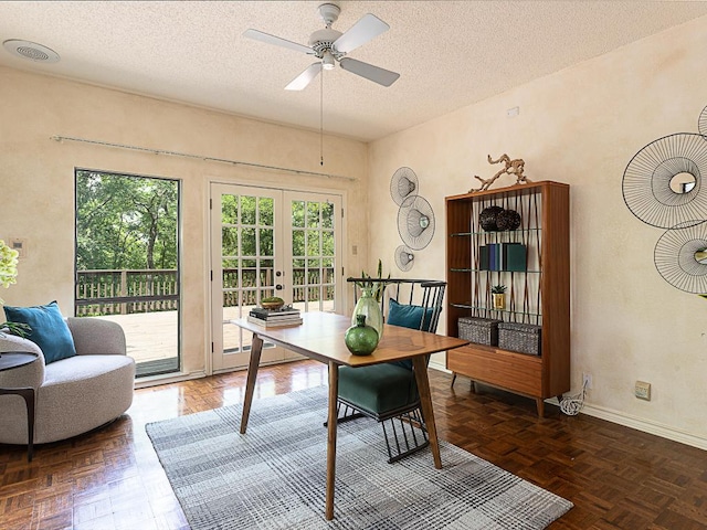 1400 Pearl Cv, Round Rock, TX 78681 - dining area with french doors, a textured ceiling, and a ceiling fan