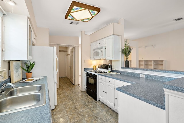 8507 Tad Park Cv, Round Rock, TX 78681 - kitchen featuring white microwave, black gas stove, a sink, and white cabinets