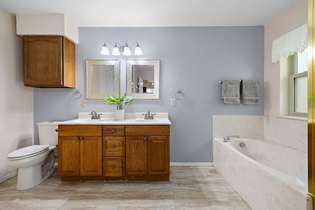 8507 Tad Park Cv, Round Rock, TX 78681 - bathroom featuring double vanity, a garden tub, toilet, and baseboards