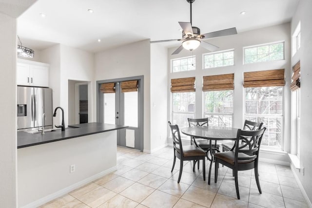 10 Lakewood Cir, Wimberley, TX 78676 - dining space featuring healthy amount of natural light, baseboards, ceiling fan, light tile patterned floors, and recessed lighting