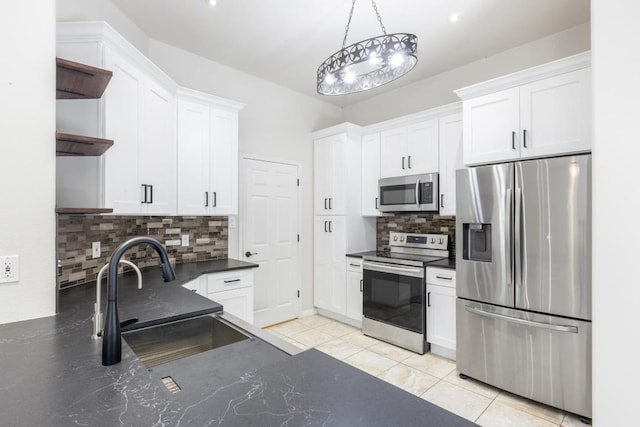 10 Lakewood Cir, Wimberley, TX 78676 - kitchen featuring stainless steel appliances, open shelves, a sink, and dark countertops
