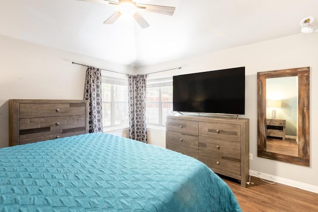 10 Lakewood Cir, Wimberley, TX 78676 - bedroom with wood finished floors, baseboards, and ceiling fan